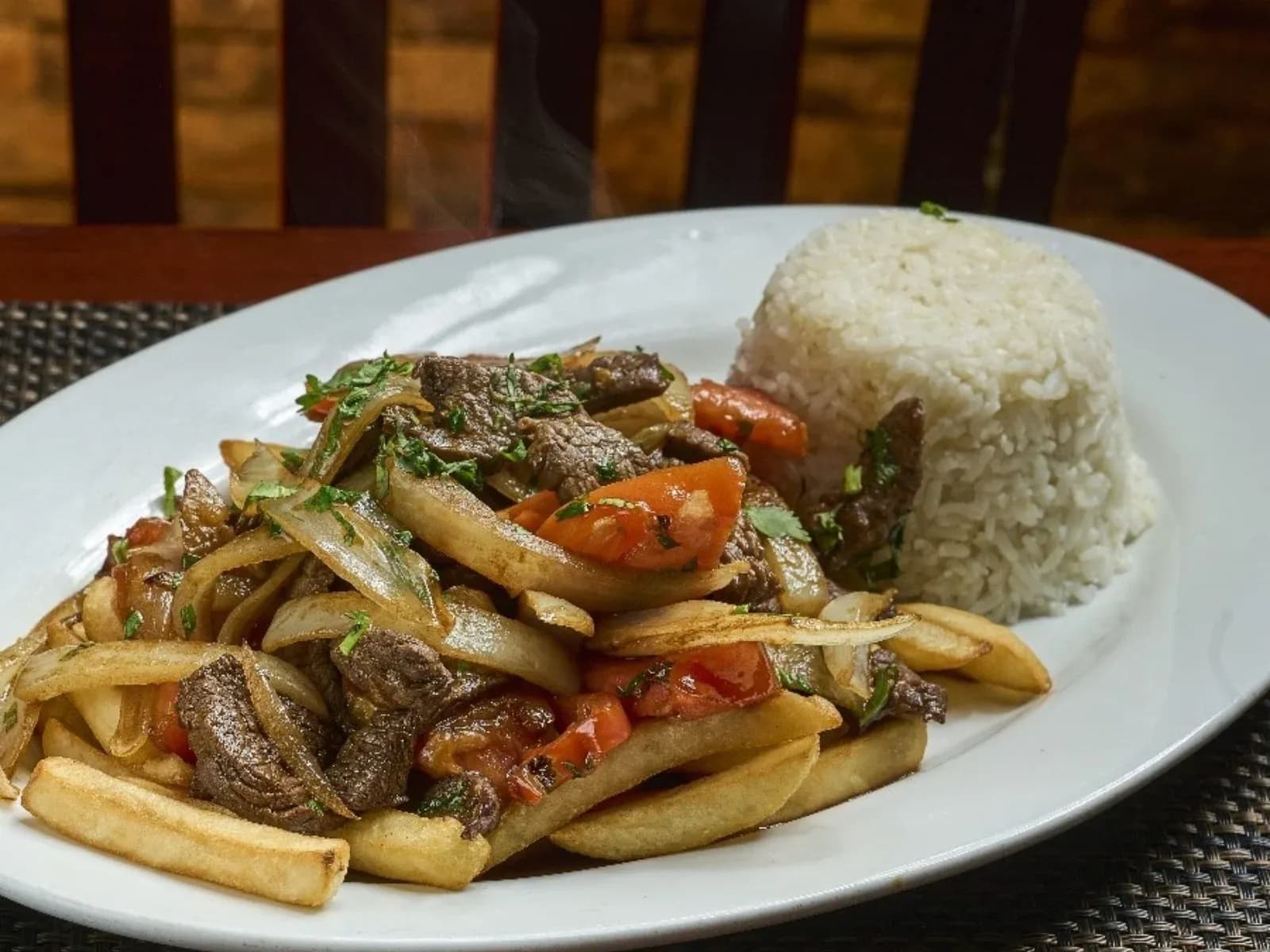 Lomo saltado with rice at Tu Casa